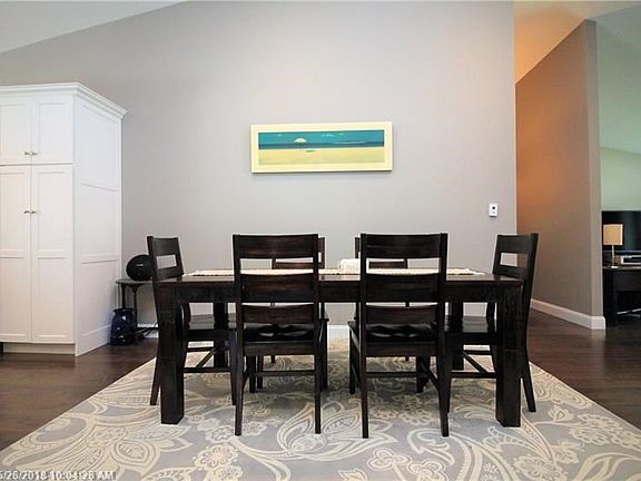 Dining area, living room in the foreground