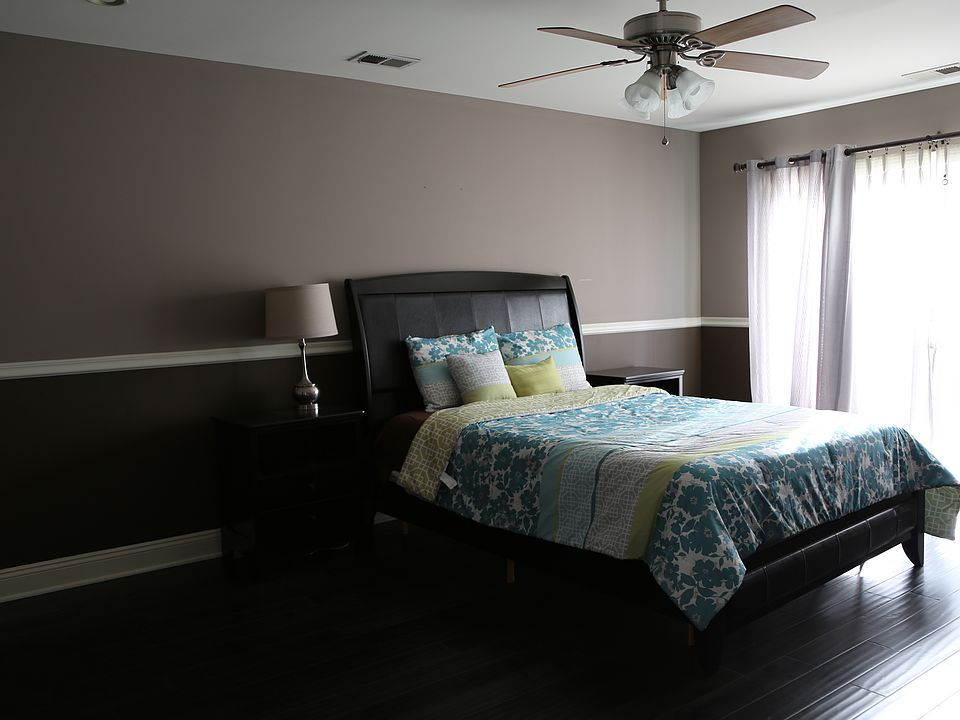 Huge Master Bedroom with a large sliding door and balcony