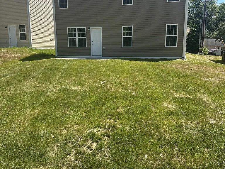 Enjoy a spacious, level backyard perfect for outdoor gatherings, play, or simply relaxing.