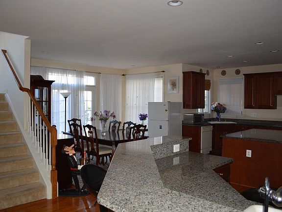 Kitchen, breakfast area, and back staircase