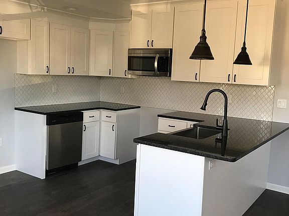 White cabinets with granite