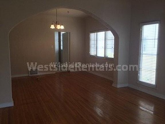 Living room looking into dining room with kitchen beyond