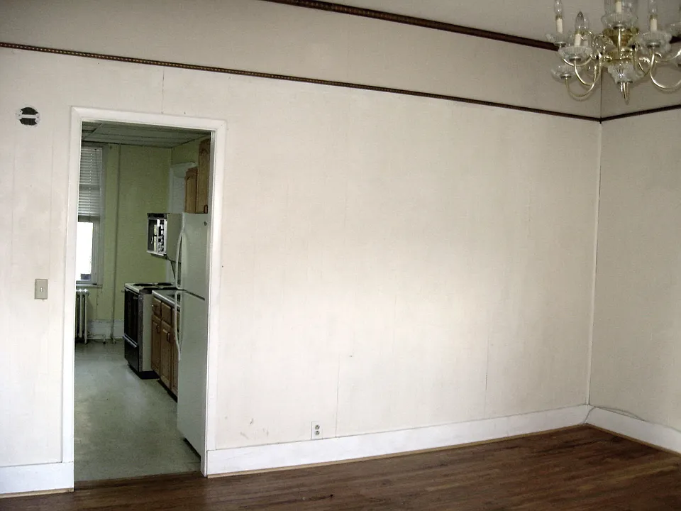 Rear view of living room looking into kitchen