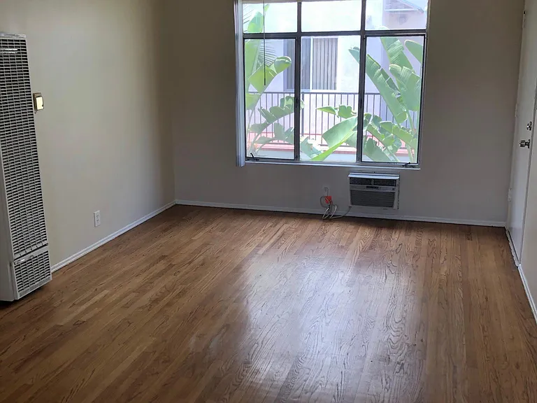 Large Bright Living Room...Hardwood Floors Throughout.