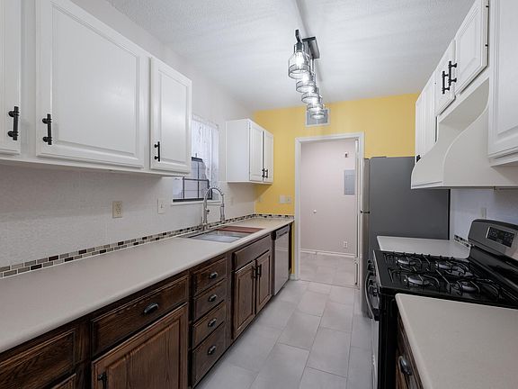 The kitchen leads conveniently to the rear entrance of the home and the laundry room. All of the home's essential functions close and convenient.