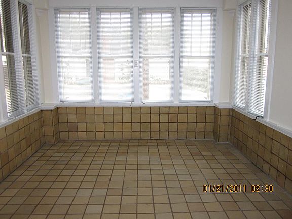 Entrance sun parlor with vintage tile floor