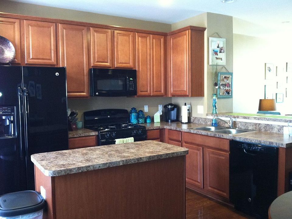 Second Floor: Open concept kitchen with island, breakfast bar, and gas cooking.