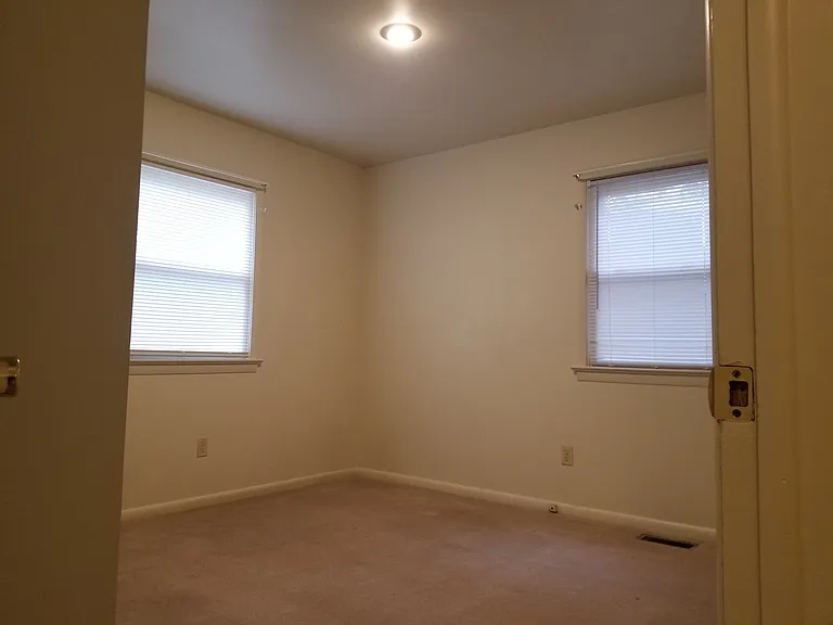 2nd bedroom has 2 windows.
Window on right faces neighbor.
Window on left faces street.