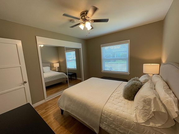 Bedroom with mirror closet