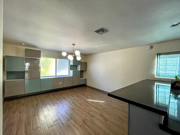 Dining Room - Dimmable lighting. Wall unit included.
