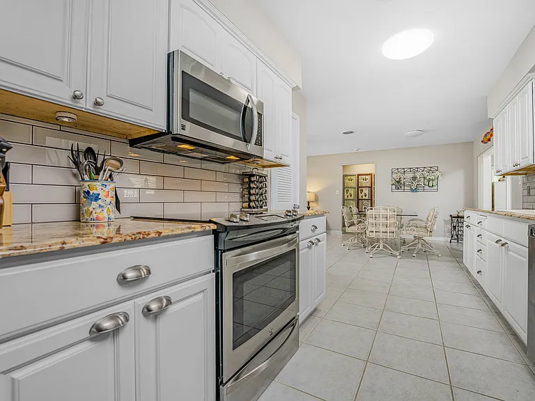 Large open kitchen with updated appliances and granite countertops