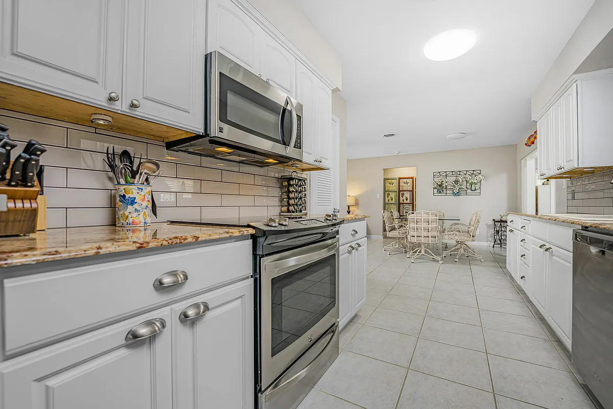 Large open kitchen with updated appliances and granite countertops - 3964 Tarpon Rd