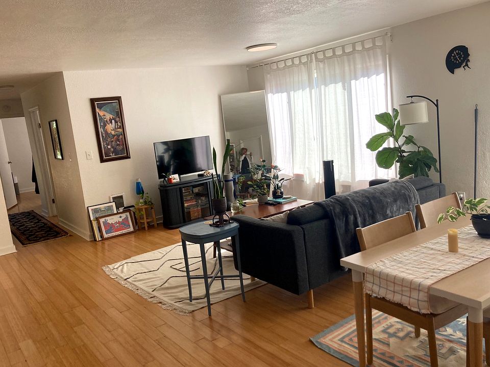 Bright living room with bamboo floors and open layout