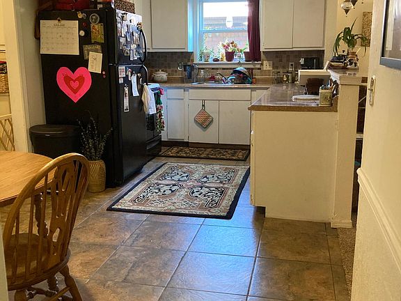 kitchen and dining room. Fridge, stove, dishwasher, table and chairs included.
