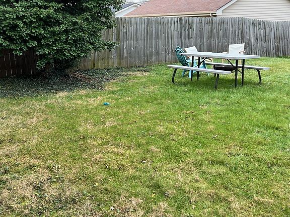 yard with outdoor picnic bench