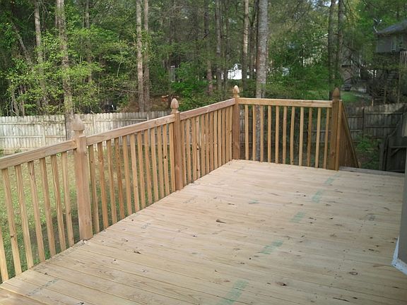 The deck has been rebuilt, and is attached to the kitchen