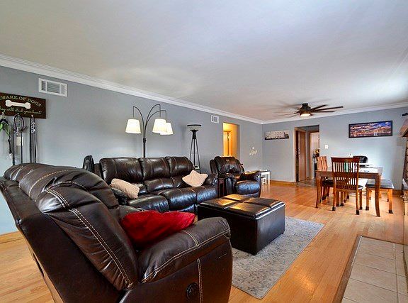 Spacious Living / Dining Room Combination, Hardwood Floors, Plaster Cove Moldings, Lannon Stone Fire
