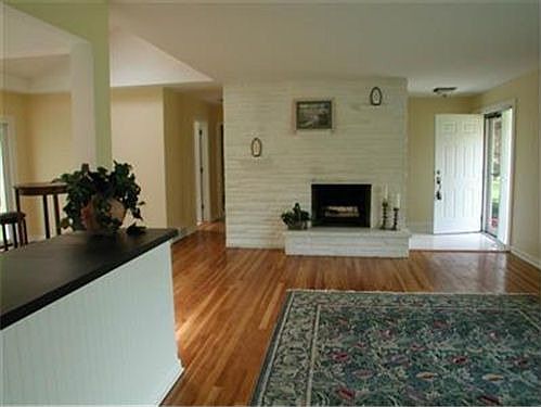 The Open floor plan is totally unexpected! Look at these lovely hardwood floor
