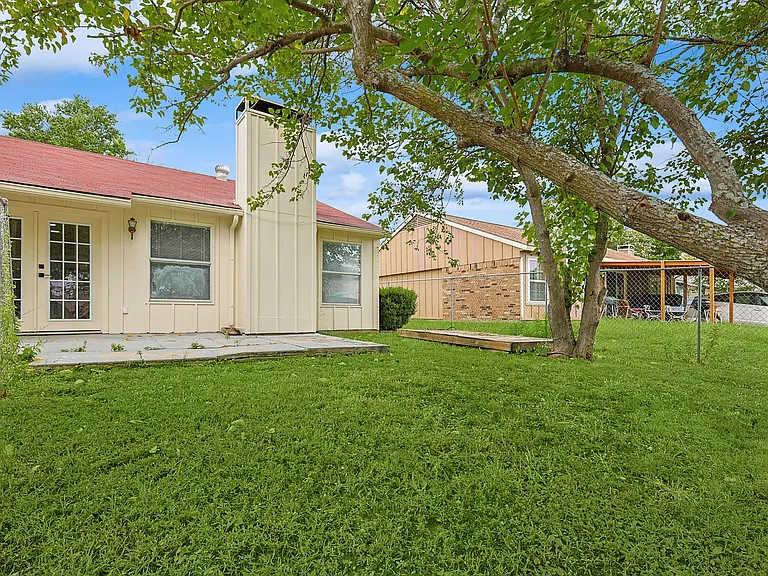 A view of the fully-fenced backyard of the property.