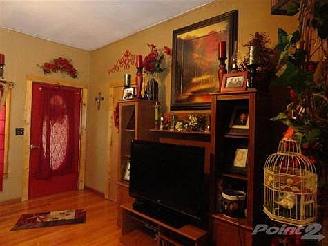 Living room with hardwood flooring.