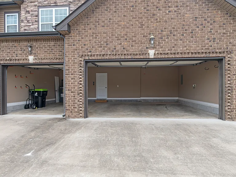 Three-Car Garage with room for storage and additional six parking spaces in driveway