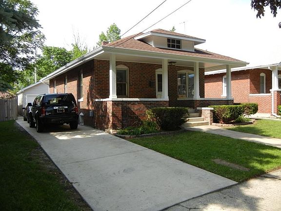 Left side view of the house and garage