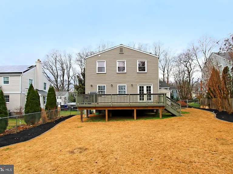 Backyard with elevated furnished deck