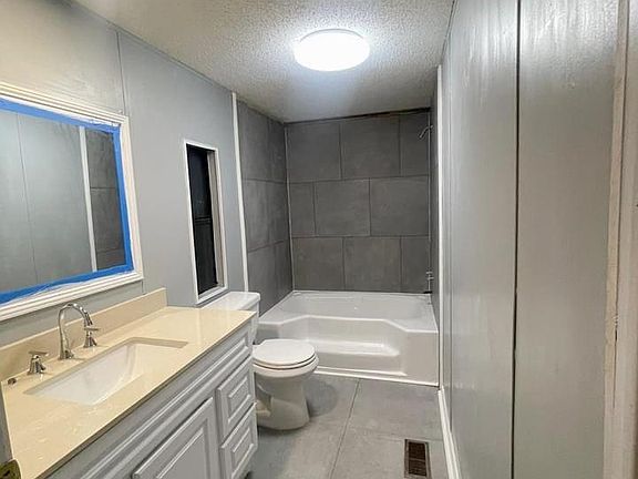 Spacious, newly-renovated bathroom located in the primary bedroom. Includes a soaking tub and large vanity!