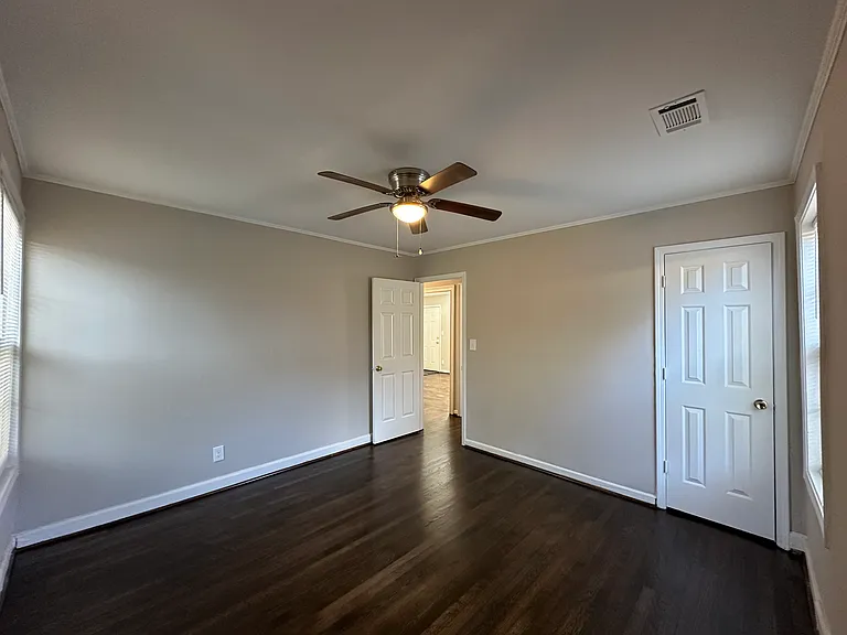 Back bedroom looking toward Family Room. Door and closet in view.