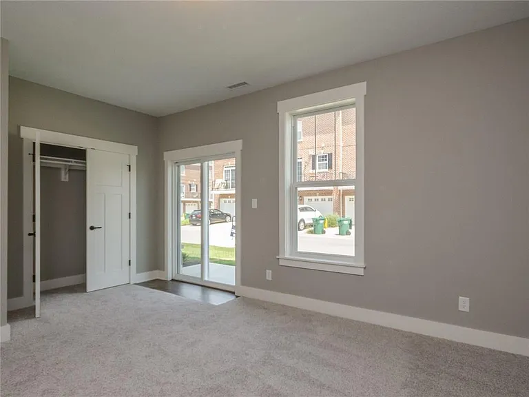 Lower level office or private bedroom with en-suite full bath; window coverings are in place (not pictured)