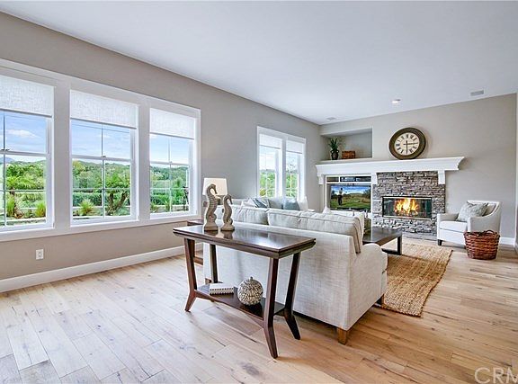 Family room with gorgeous views from every window, note the new contemporary window treatments