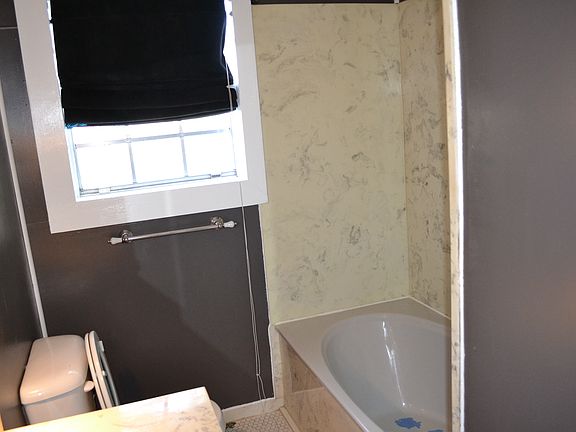 bathroom with large tub