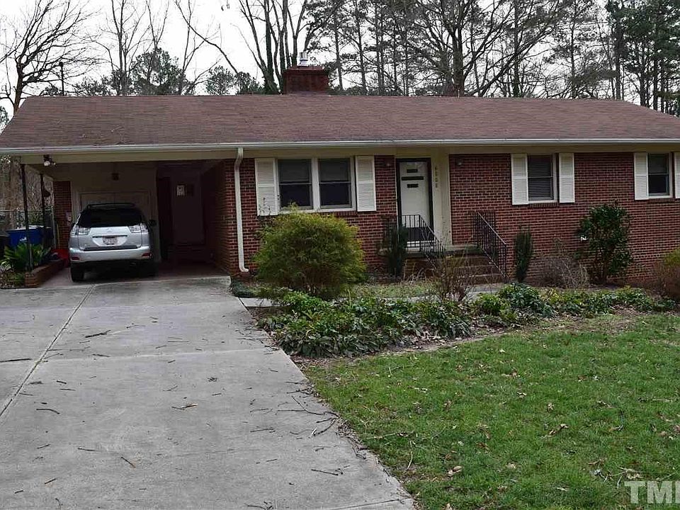 Brick ranch with carport.