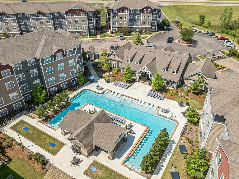 Enjoy a resort-style experience at The Flatts Starkville with a pool, hammock garden, grilling stations, and outdoor games like cornhole, all near MSU.