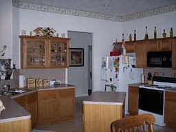 Charming island kitchen with lots of counter space and stora