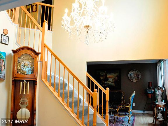 2 Story Foyer With Elegent Crystal Chandelier