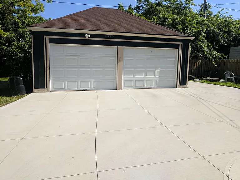 2 car garage with remote opener and extra car spot