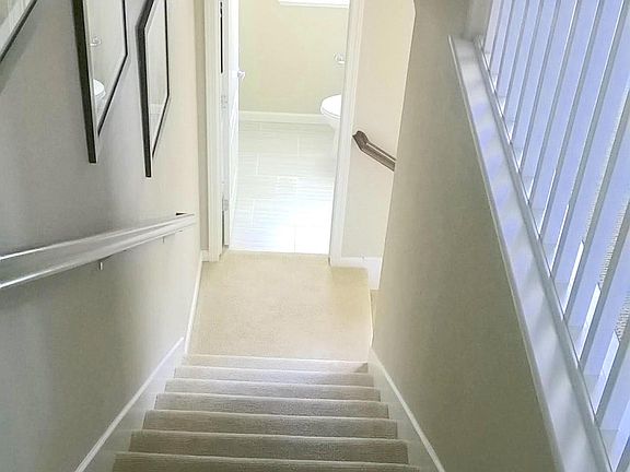 2nd flight of stairs leading to the 2nd floor where the main living areas are - kitchen / dining room / living room.