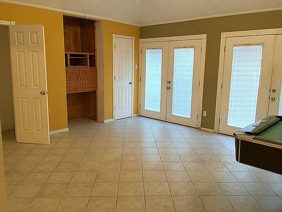Gameroom with half bathroom. Great for entertaining.