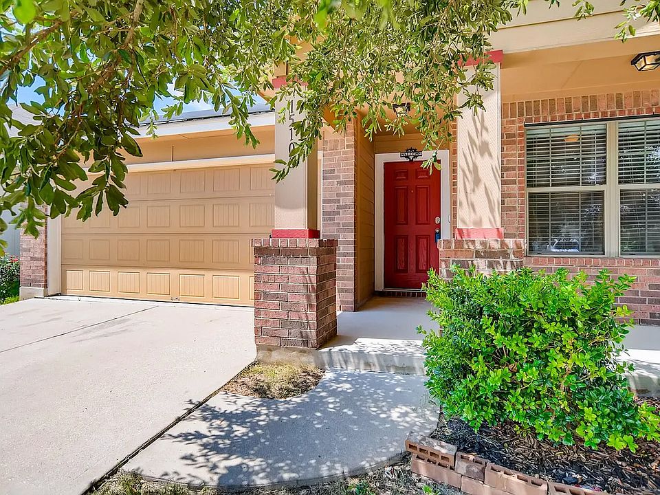 This charming red entrance door is hard to miss!