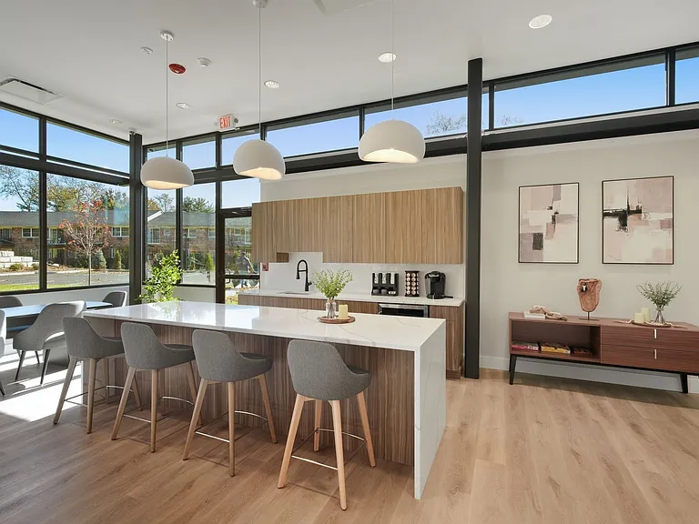 Elevate your lifestyle at Eagle Rock Apartments at Woodbury. This modern kitchen features sleek design and ample space, perfect for culinary creations and gatherings. Unleash your inner chef todayschedule a tour now!