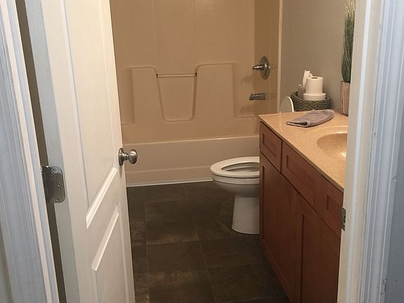 Full bathroom by kitchen