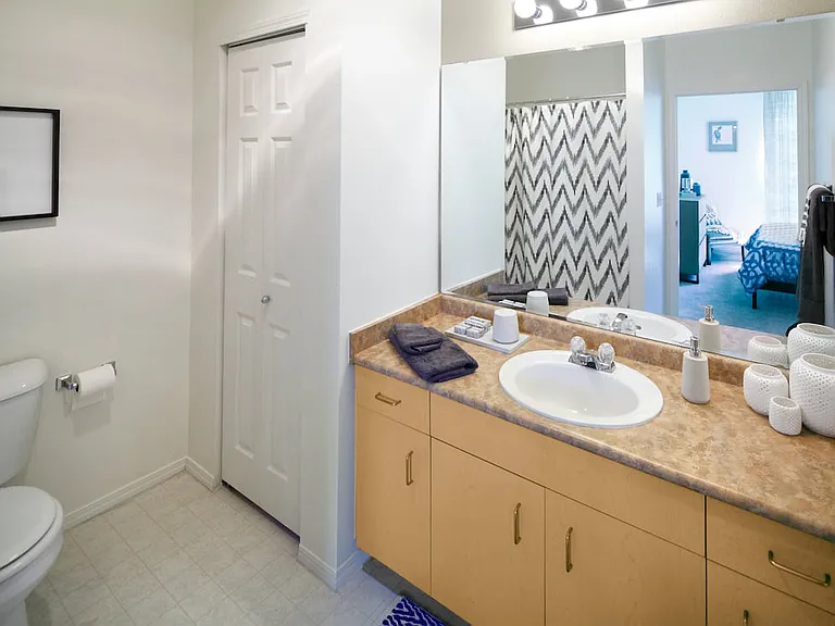 Classic Package I bath with oak cabinetry, laminate countertops, and hard surface flooring