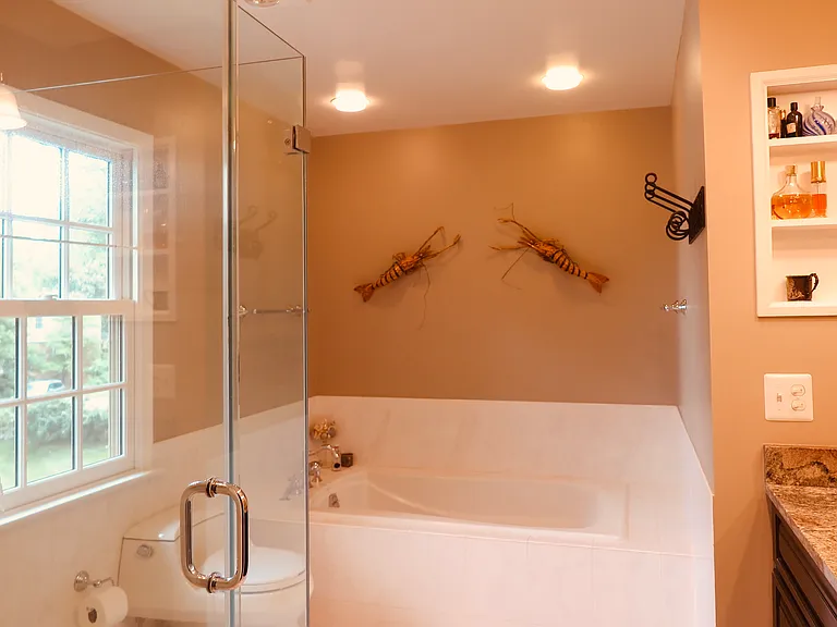 Primary bathroom. Pocket door from bedroom.
