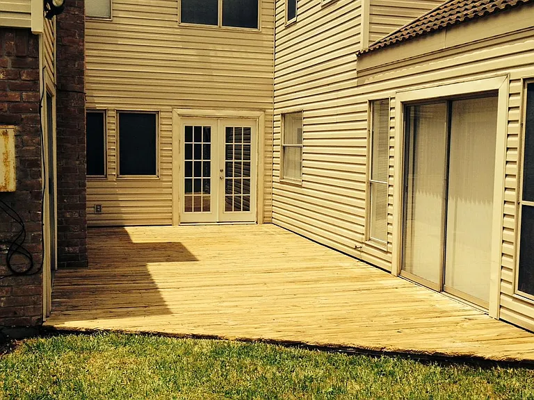 Large Deck in back (house wraps around deck)