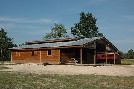 New 5 stall barn with patio, electric, water, tack room 