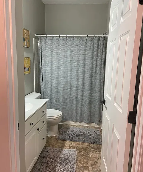 Private hall bath with linen closet and extra storage.