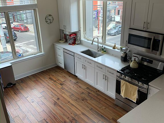 Beautiful large kitchen with all Samsung Stainless steel appliances. Large windows with lots of sunshine.