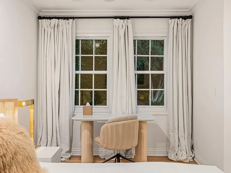 Combine work and relaxation in a bedroom with dedicated desk space and high-speed internet.