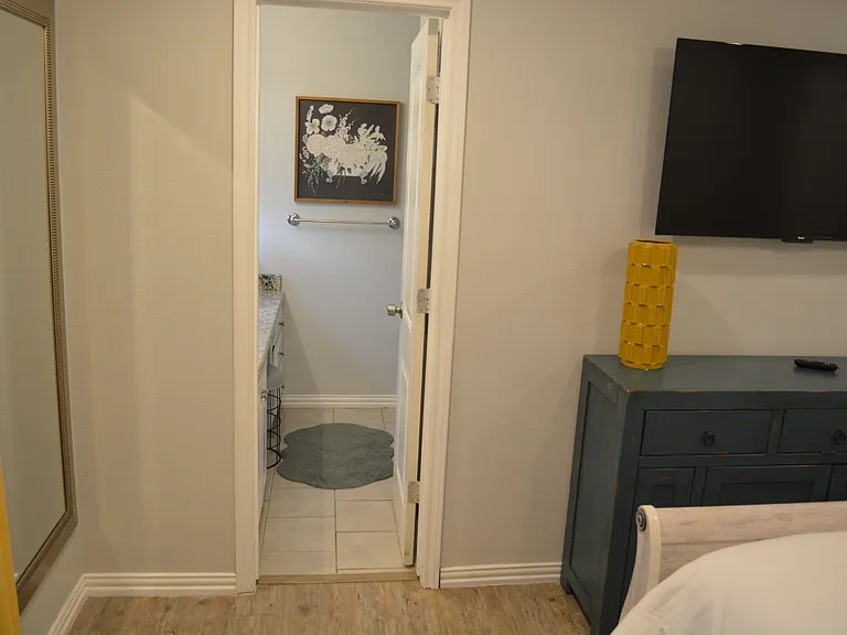 Bedroom 1 - a queen bed, smart tv and attached to bathroom 2.